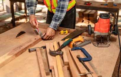 close-up-hand-carpenter-working-woodworking-machines-carpentry-shop-carpenter-works-construction-site_61243-1243